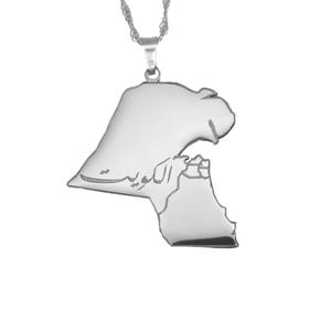 May include: A silver pendant necklace. The pendant is shaped like a country's outline, with Arabic script. The pendant hangs from a delicate silver chain. The necklace is set against a white background.
