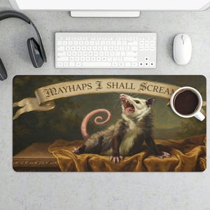 May include: A rectangular mousepad featuring a vintage painting of an opossum with its mouth open, with the text "MAYHAPS I SHALL SCREAM" on a banner above it. The opossum is lying on a golden cloth. A cup of coffee is on the right.