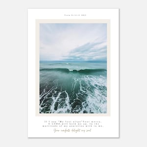 May include: A framed print with a photograph of ocean waves in shades of teal and white, under a cloudy sky. The text at the top reads "Psalm 94:18-19 NKJV." The bottom text reads "If I say 'My foot slips' Your mercy..."