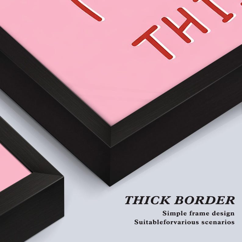 May include: Close-up of two framed artworks with thick black borders. The artwork features a pink background with red text. The bottom right corner of the image shows the text "THICK BORDER" and additional text below it.