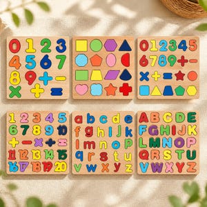 May include: Six square wooden puzzle boards featuring colourful, recessed cutouts of numbers, mathematical symbols, geometric shapes, and both lowercase and uppercase letters of the alphabet. Each board displays a grid of distinct, vibrant pieces.