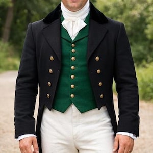 May include: A man in a historical costume, wearing a black tailcoat with gold buttons over a green vest. He is also wearing white pants and black boots. The outfit is reminiscent of the Regency era.