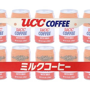 May include: A collection of UCC Coffee cans with milk, each with a peach-colored top and a red and white label. The cans are arranged around a license plate frame with the words "UCC COFFEE" and Japanese text.
