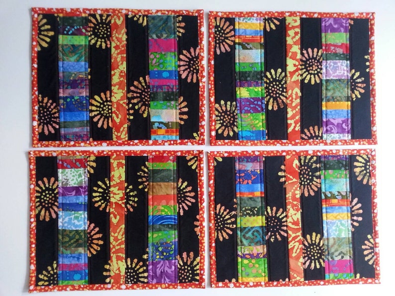 SOLD Four quilted placemats bright summer colors batik cotton sunflowers polka dots black red multi color patio placemats washablereversible