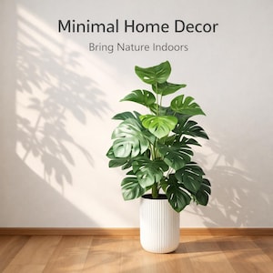 May include: A large, artificial Monstera plant in a white, ribbed planter. The plant has large, green, split leaves. The image includes the text "Minimal Home Decor" and "Bring Nature Indoors". The plant is placed on a wooden floor against a white wall.