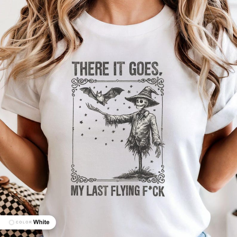 Model wearing a white t-shirt printed with "Graveyard Bat Catcher" across the chest.