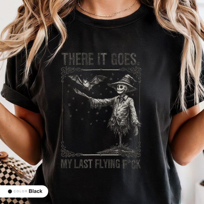 Model wearing a black t-shirt printed with "Graveyard Bat Catcher" across the chest.