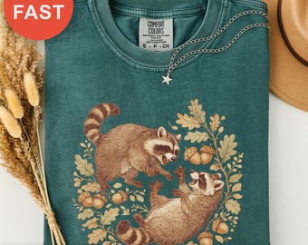Nature's Little Mischiefs Shirt, Playful Raccoon Tee, Foliage and Acorns Design, Whimsical Animal Top, Hand-drawn Gift Tee, Woodland Gift