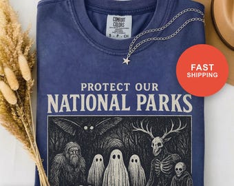 未確認生物保護シャツ、国立公園を守らないと裏庭に現れるぞ、ビッグフットファンTシャツ、コンフォートカラーズTシャツ、モスマン伝説