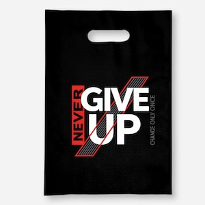 May include: Black tote bag with a die-cut handle. The bag features the words "NEVER GIVE UP" in white, red, and gray, with the phrase "CHANGE ONLY ONCE" printed vertically on the right side.