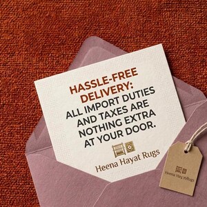 May include: A square off-white card with dark brown text reading HASSLE-FREE DELIVERY: ALL IMPORT DUTIES AND TAXES ARE NOTHING EXTRA AT YOUR DOOR. Below the text are two small icons and the brand name Heena Hayat Rugs, with a brown tag attached.