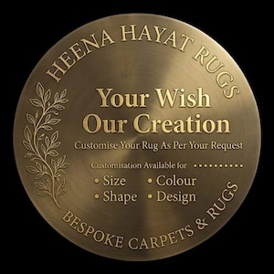 May include: A circular bronze-toned metal plaque featuring the text HEENA HAYAT RUGS, Your Wish Our Creation, Customise Your Rug As Per Your Request, and Customisation Available for Size, Colour, Shape, Design, Bespoke Carpets & Rugs with a leaf design.