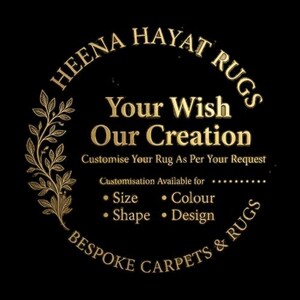 May include: A circular logo with gold text on a black background. The text reads "HEENA HAYAT RUGS" and "Your Wish Our Creation". It also states "Customise Your Rug As Per Your Request" and lists customization options: Size, Colour, Shape, and Design. A decorative floral element is on the left.