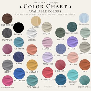May include: A color chart with a variety of fabric colors, including Espresso, Black, White, and Navy. The chart displays the Comfort Colors 1717 collection, with each color sample in a circular shape. Text at the top reads "Color Chart".