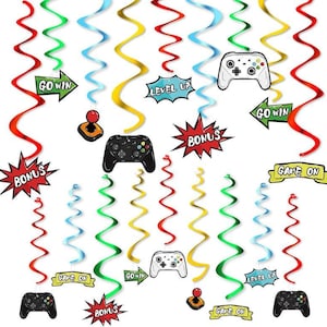 May include: Colorful video game-themed party decorations. The image features hanging swirls in red, green, yellow, and blue, along with game controllers, speech bubbles with text like "Bonus" and "Level Up", and arrows with "Go Win" and "Game On" text.