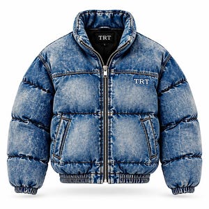May include: A blue acid-wash denim puffer jacket with a high collar and a full-length silver zip. The jacket features horizontal quilted panels, two side pockets, and the text TRT embroidered in white on the left chest and inner label.