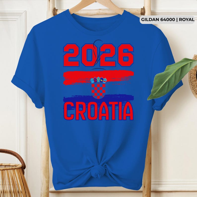 May include: Royal blue t-shirt with the text "2026" in red above a red brushstroke and the word "CROATIA" in red. The Croatian flag is featured in the design. The shirt is a Gildan 64000 Royal.