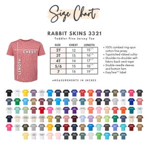 May include: A size chart for Rabbit Skins 3321 toddler fine jersey tees. The chart includes chest and length measurements in inches for sizes 2T to 7. The image also shows a sample tee and a wide array of available colors.