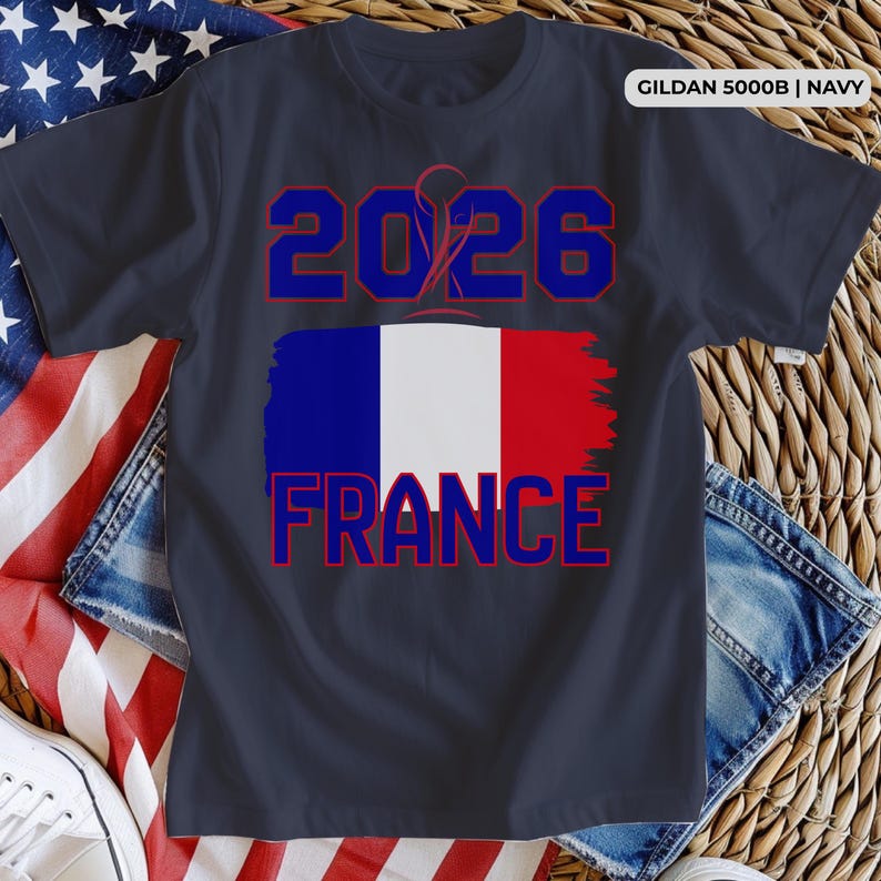 May include: Navy blue t-shirt with the text "2026 FRANCE" in red and blue, featuring the French flag design. The shirt is made of a soft material and is suitable for casual wear.
