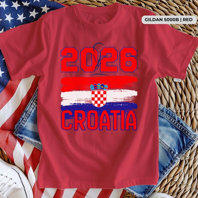 May include: Red t-shirt with the text "2026 CROATIA" in blue and red. The design includes a Croatian flag graphic. The shirt is a Gildan 5000B in red.