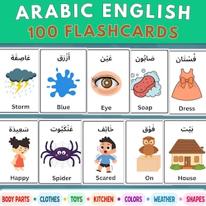 May include: A set of 100 Arabic English flashcards featuring illustrations and text for words like storm, blue, eye, soap, dress, happy, spider, scared, on, and house. The cards are white with black text and colorful graphics, organized in rows.