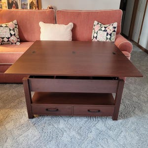 May include: A set of three ceramic mugs with a speckled, matte finish. The mugs are in shades of cream, light gray, and dark gray. Each mug has a simple, minimalist design and a rounded handle.