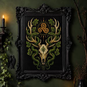 May include: A rectangular black ornate frame containing a cross-stitch embroidery on black fabric. The design features a deer skull with large antlers, intertwined with green vines and oak leaves, topped by a golden triskelion symbol.