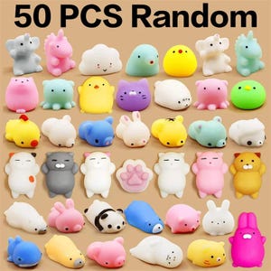 May include: A selection of 50 random, colourful, squishy toys in animal shapes, such as elephants, unicorns, cats, and bunnies. The toys are in shades of pink, blue, yellow, and white, with some featuring paw prints.