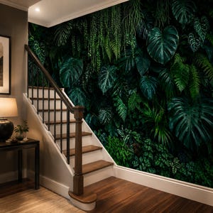 May include: A wall mural featuring a dense, lush jungle scene with various shades of green tropical leaves, including large monstera and fern foliage, covering the entire wall surface next to a wooden staircase with a dark brown handrail.