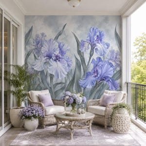 May include: A cozy outdoor seating area featuring two wicker armchairs with white cushions, a round coffee table, and a floral rug. The focal point is a large mural of blue iris flowers on the wall, creating a serene and inviting atmosphere.