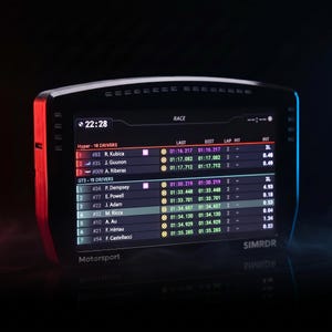 May include: A black digital racing dashboard display with a glowing screen showing a race leaderboard with driver names, lap times, and intervals. The device features the text Motorsport and SIMRDR on the front frame with red and blue side lighting.