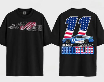 May include: A black short-sleeve t-shirt featuring a front graphic with a checkered flag and the text Joe Gibbs Racing. The back displays a large number 11 with a stars and stripes pattern, a blue race car, and the text Denny Hamlin.