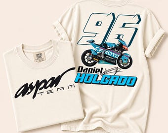 May include: Off-white t-shirt featuring the black text 'aspar TEAM' on the front. The back displays a large number '96' in blue, a teal CFMOTO racing motorcycle, and the text 'Daniel HOLGADO' in blue with a black outline and a signature graphic.