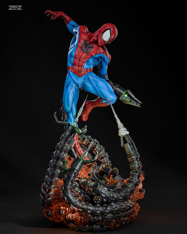 May include: A detailed figurine of Spider-Man in a dynamic pose, clad in a red and blue suit, with a black spider emblem. The figure is mounted on a base featuring mechanical tentacles and a fiery, orange-red glow.
