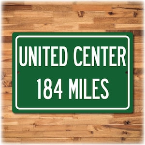 Green United Center highway distance sign reading '184 MILES' on heavy gauge aluminum; Chicago Bulls/Blackhawks souvenir.
