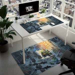 May include: A white desk with a computer, keyboard, and mouse, featuring a desk mat and floor mat with a cartoon cityscape design. The computer screen displays the text "DESK CRA:". A black office chair is in the foreground.