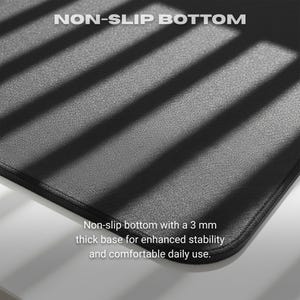 May include: Black mouse pad with the text "NON-SLIP BOTTOM". The pad has a 3 mm thick base for stability and comfortable use. The surface is textured and the edges are stitched.