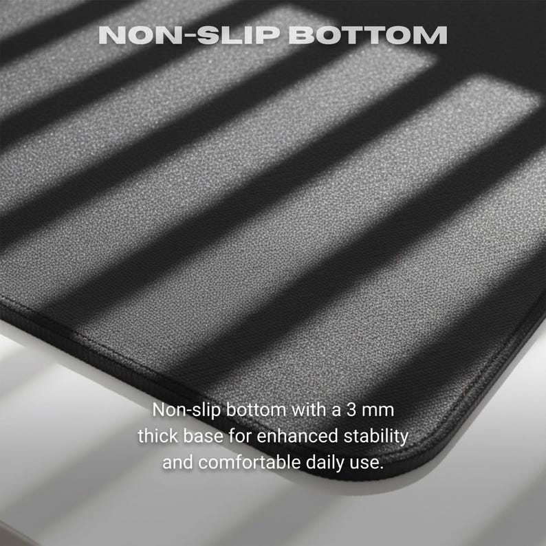 May include: Black mouse pad with the text "NON-SLIP BOTTOM". The pad has a 3 mm thick base for stability and comfortable use. The surface is textured and the edges are stitched.