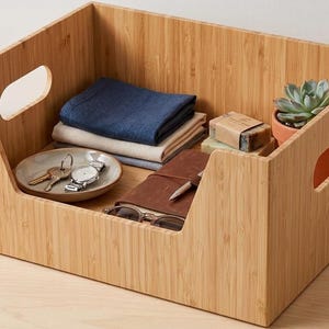 May include: A rustic wooden sign with the text "Welcome to our home" in a handwritten style. The sign features a distressed finish and a simple, inviting design, perfect for a front porch or entryway.