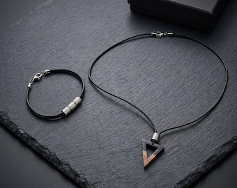 Minimalist geometric urban style necklace and bracelet set with black resin, walnut wood, leather cords, and steel accents
