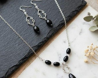 Collier et boucles d'oreilles pendantes en acier inoxydable noir, perles de verre, design graphique élégant, hypoallergénique