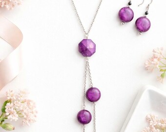 Long asymmetrical necklace with rich purple acrylic beads, stainless steel chain, silver and black accents, modern flair