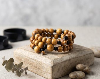 Serpentine multi-wrap bracelet, natural olive wood beads, matte black onyx stones, stainless steel accents, elegant dangling beads