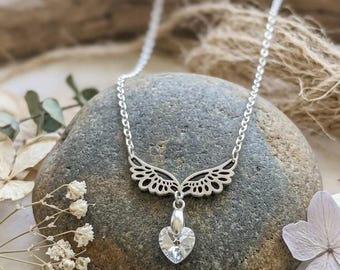 Delicate angel wings pendant with iridescent Aurora Borealis heart crystal, hypoallergenic stainless steel necklace