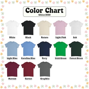 May include: A color chart featuring Gildan 5000 t-shirts in various colors, including white, black, light blue, and maroon. The chart displays the color names below each shirt, such as "Carolina Blue" and "Irish Green."