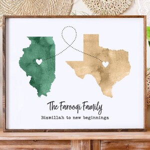 May include: A rectangular framed print featuring a green watercolor map of Illinois and a tan watercolor map of Texas, connected by a dotted line with white hearts. The text reads The Farooqi Family and Bismillah to new beginnings.
