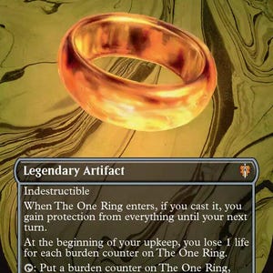 May include: A Magic: The Gathering card featuring "The One Ring." The card displays a golden ring with a glowing effect. The text at the top reads "The One Ring" and the card is labeled as a "Legendary Artifact."