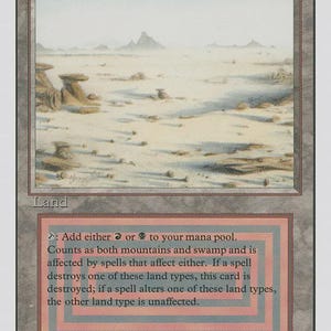 May include: A collectible trading card titled Badlands featuring an illustration of a desolate, arid landscape with rocky formations under a pale sky. The card text includes game mechanics for adding red or black mana to a player's mana pool.