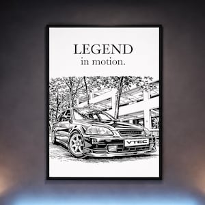 May include: Black and white framed print featuring a detailed illustration of a car. The artwork includes the text "LEGEND in motion." The car has the word "VTEC" on the front.