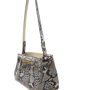 May include: A grey and white snakeskin-patterned handbag with a long, cream-coloured strap. The bag features gold-coloured hardware, including a clasp and buckles. The interior of the bag is a light beige colour.